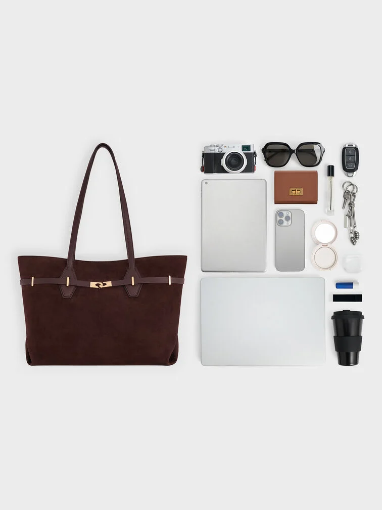 : Featuring the Arlet tote bag showing what fits in the bag, which includes a laptop, tablet and other daily essentials. 