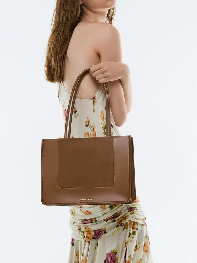 The Daylla tote is a compact bag option for everyday commute to the office.  