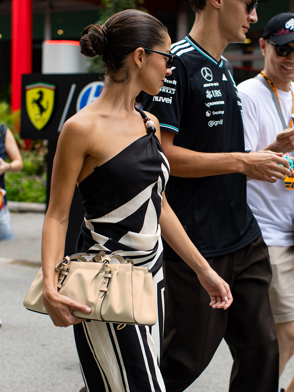 Women’s Britton ruched elongated shoulder bag & Pauline patent crossover slingback kitten heels, as seen on Carmen Montero Mundt – CHARLES & KEITH