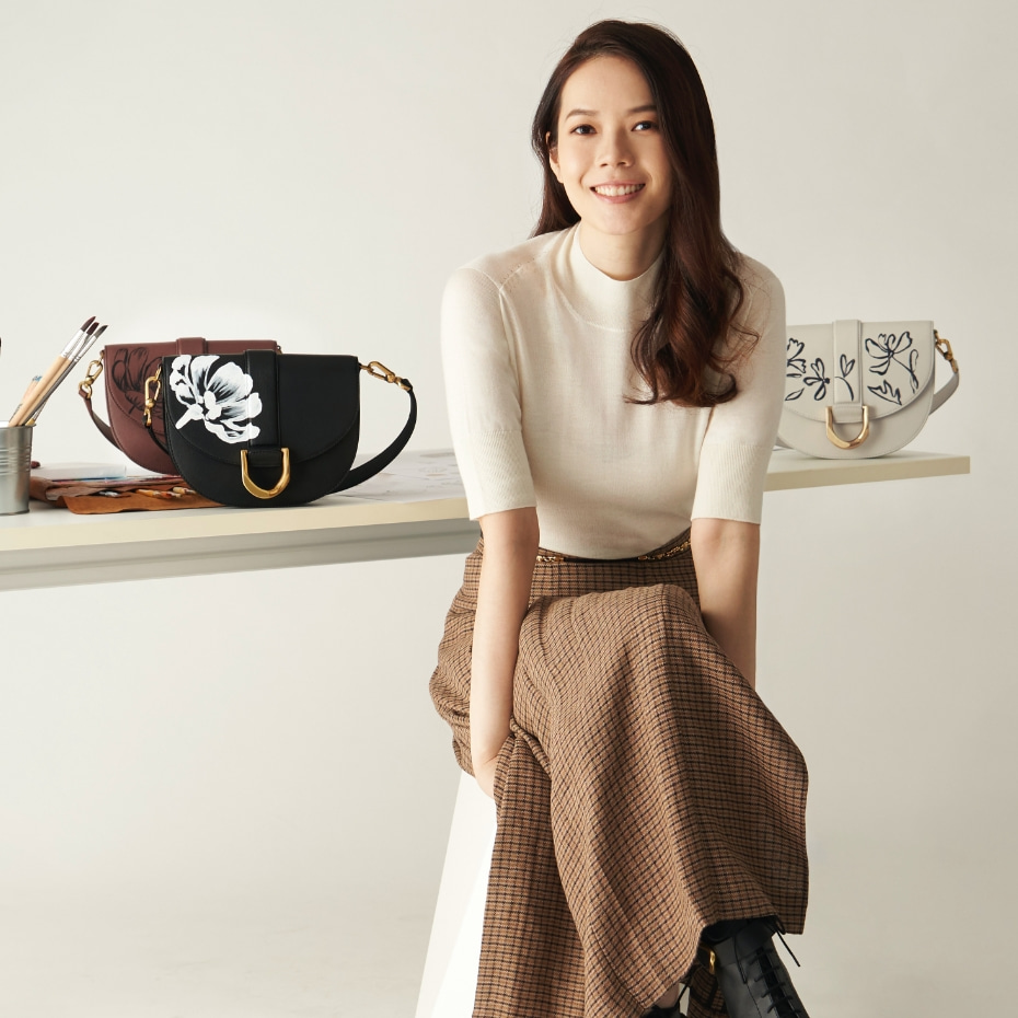 Hand-painted floral Gabine leather saddle bags in brown and chalk - CHARLES & KEITH