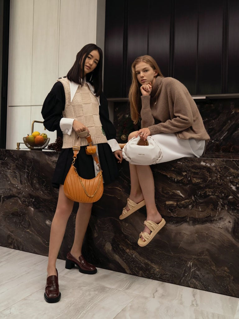 women’s chain handle pleated moon bag, chain handle braided hobo bag, penny loafer pumps and twist strap padded slide sandals - CHARLES & KEITH