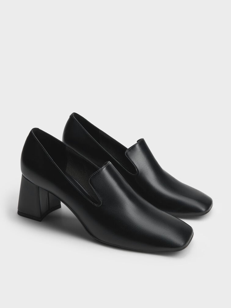 Black loafer pumps that are ideal for work and semi-formal occasions.