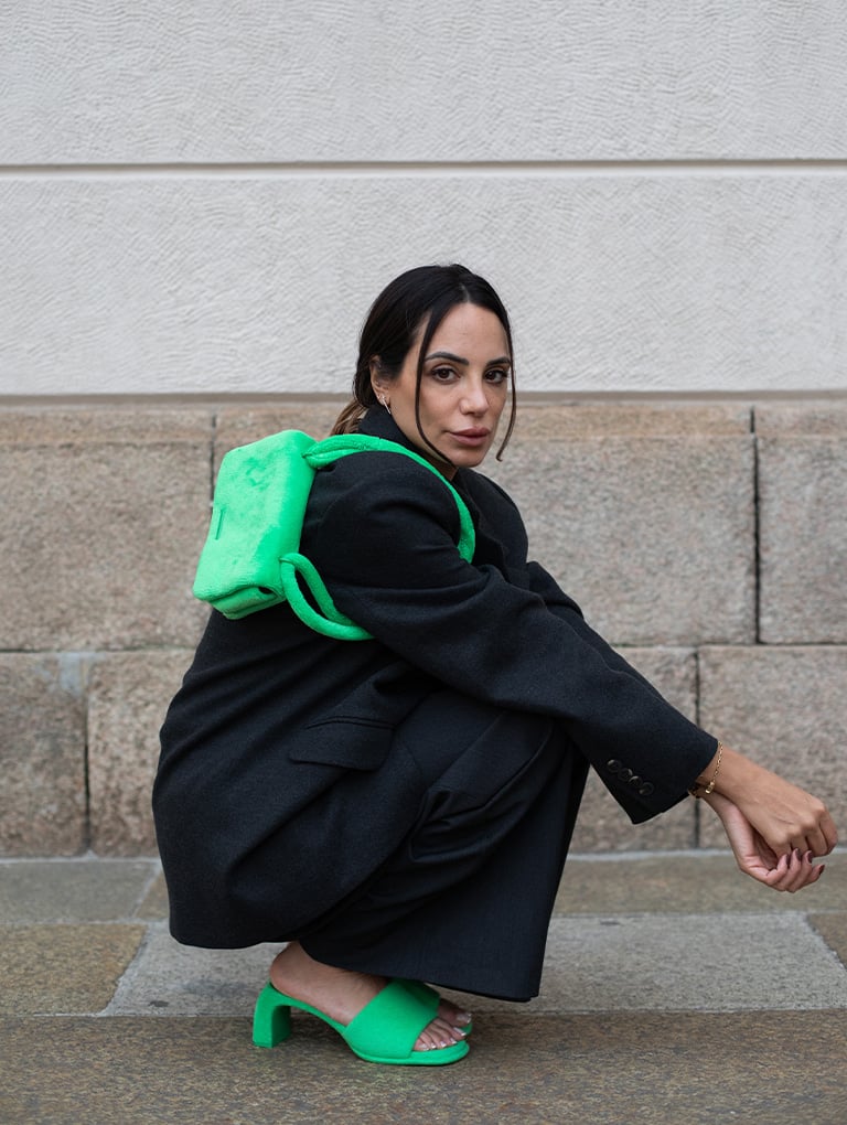 Women’s Loey textured crossbody bag and Loey textured curved heel mules in green, as seen on Zeynab El-Helw – CHARLES & KEITH