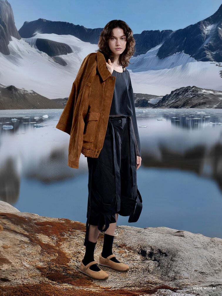 Minimalist suede Mary Jane sneakers are a versatile and comfortable option for travel.