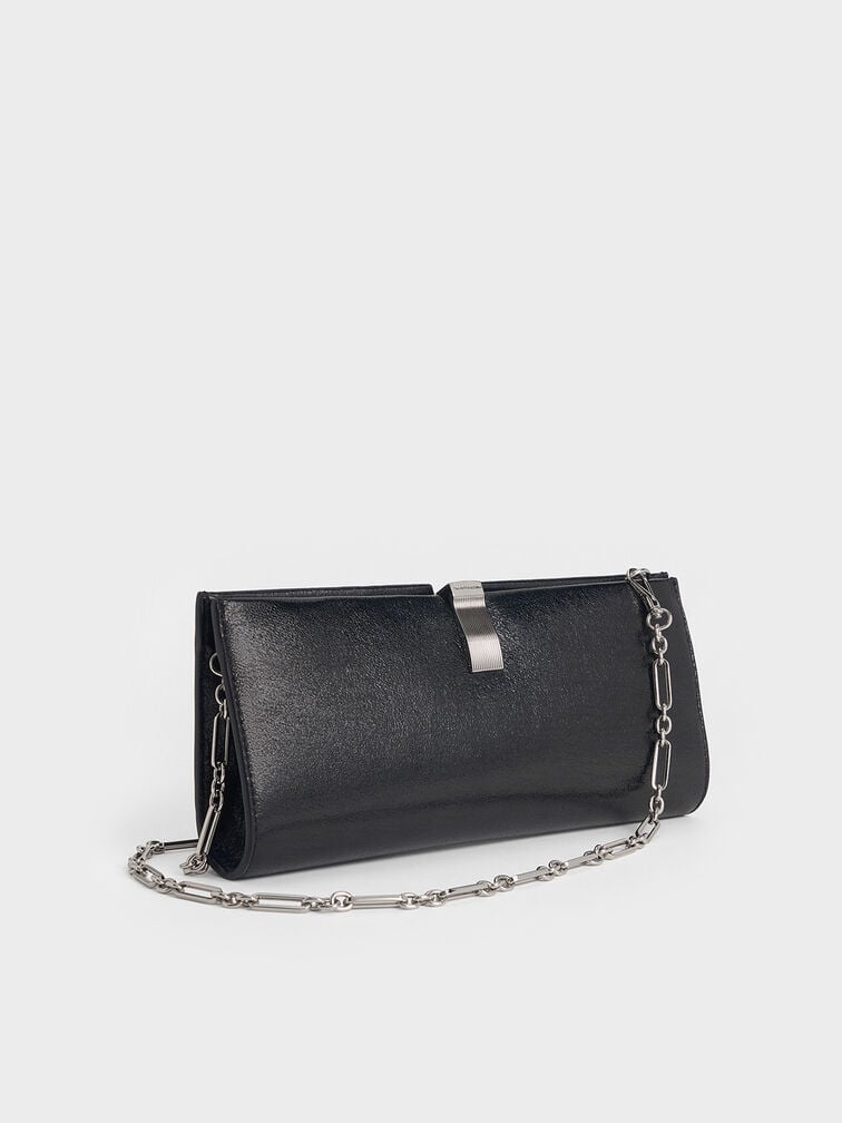 Black structured clutch with chain strap, suitable for weddings and formal events.