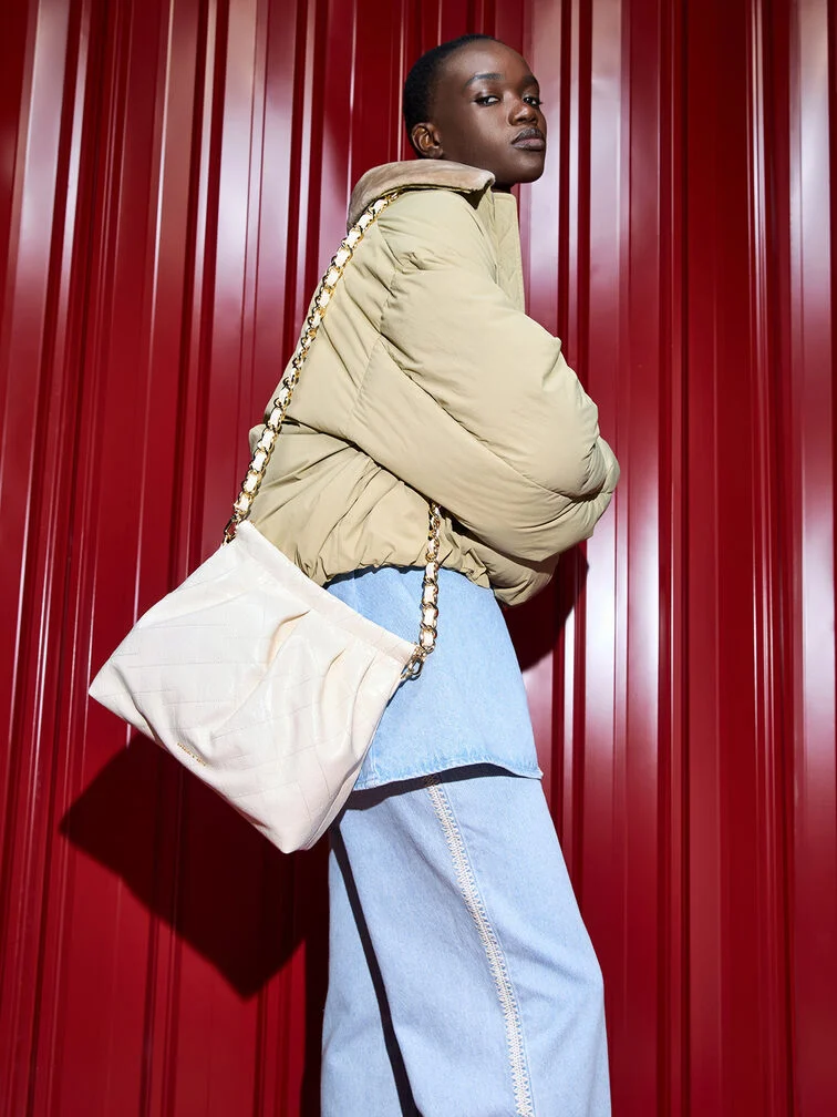 A striking crossbody bag in a contrasting colour will add an edge to a denim-on-denim look 