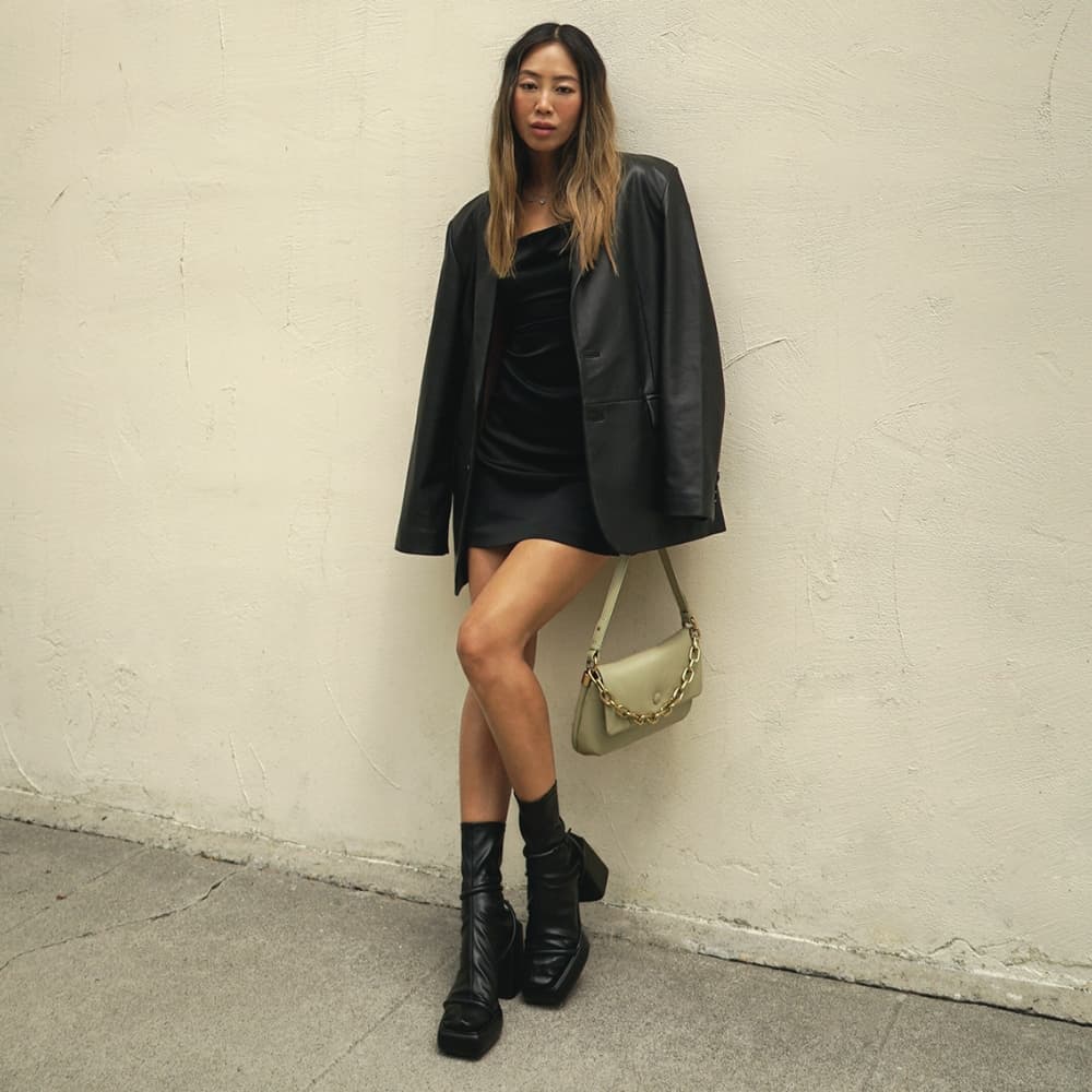 Women's taupe Zadie padded shoulder bag and black Lucile platform calf boots, as seen on Aimee Song - CHARLES & KEITH