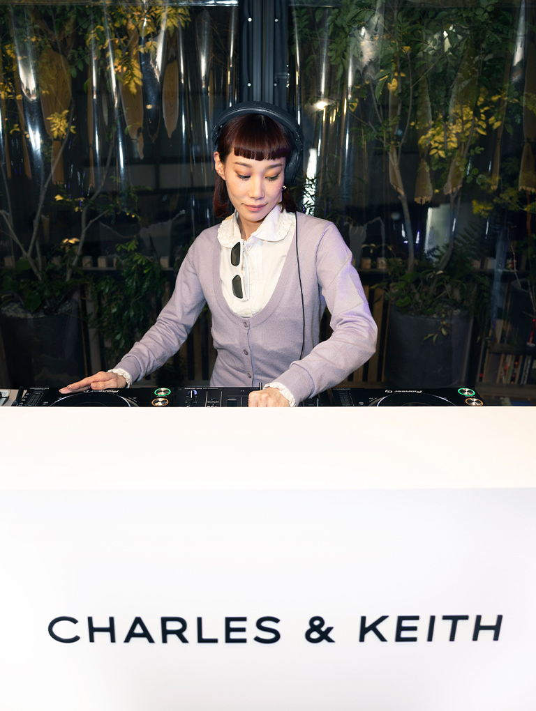 DJ Mademoiselle Yulia behind the CHARLES & KEITH DJ booth at CENSU TOKYO