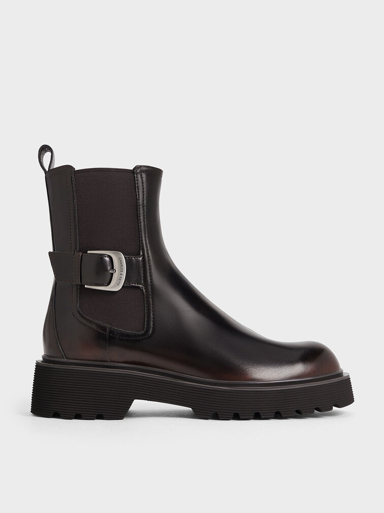 Dark brown Chelsea boots with elastic side panels.