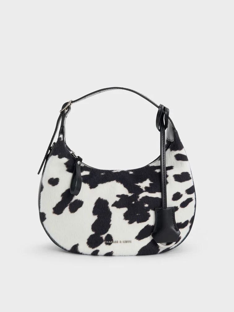 A cow-print bag is eye-catching yet unexpectedly versatile.
