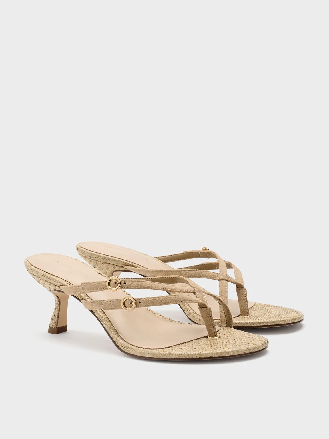 Crossover toe-ring strappy heels with a woven finish.
