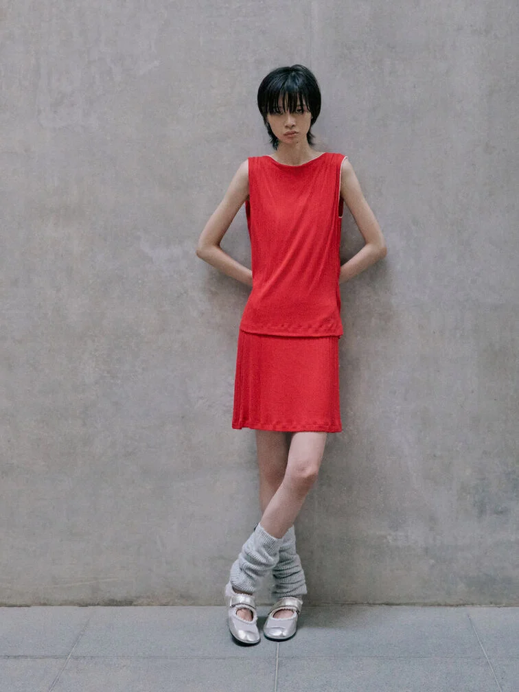 Silver Mary Jane sneakers paired with a bright red dress.
