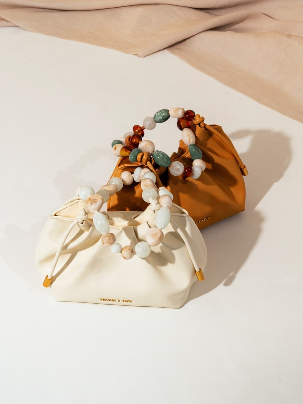 Women's cream and pumpkin Aviary beaded acrylic handle slouchy bag - CHARLES & KEITH