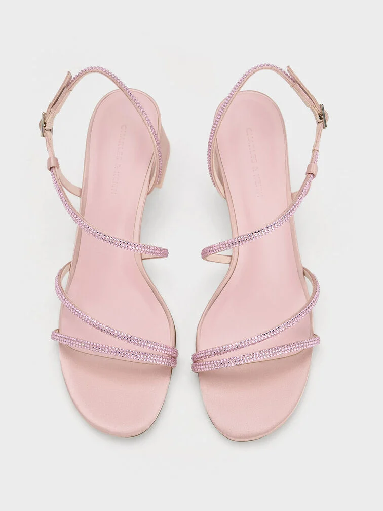 Light pink crystal-embellished strappy sandals, a popular choice for year-end festivities.