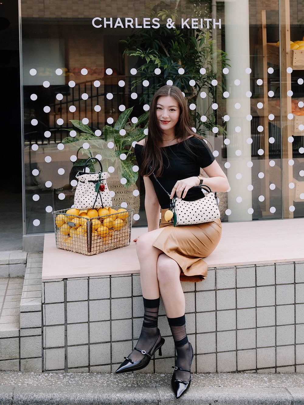 Hazel Bow Polka-Dot Top Handle Bag in cream and lemon charm - CHARLES & KEITH