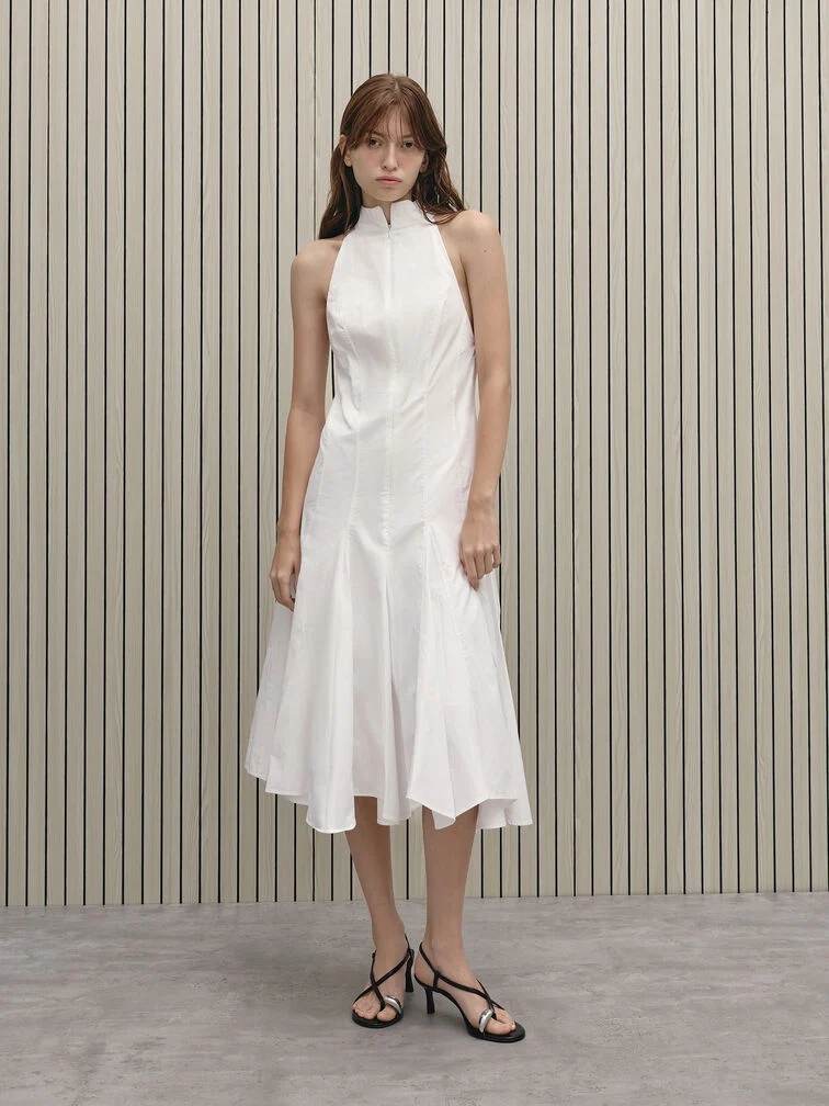 Pair strappy heeled sandals with a flowy white dress to create a failproof spring-summer outfit. 