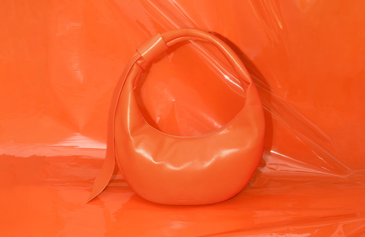 Women’s Toni knotted curved hobo bag in orange - CHARLES & KEITH