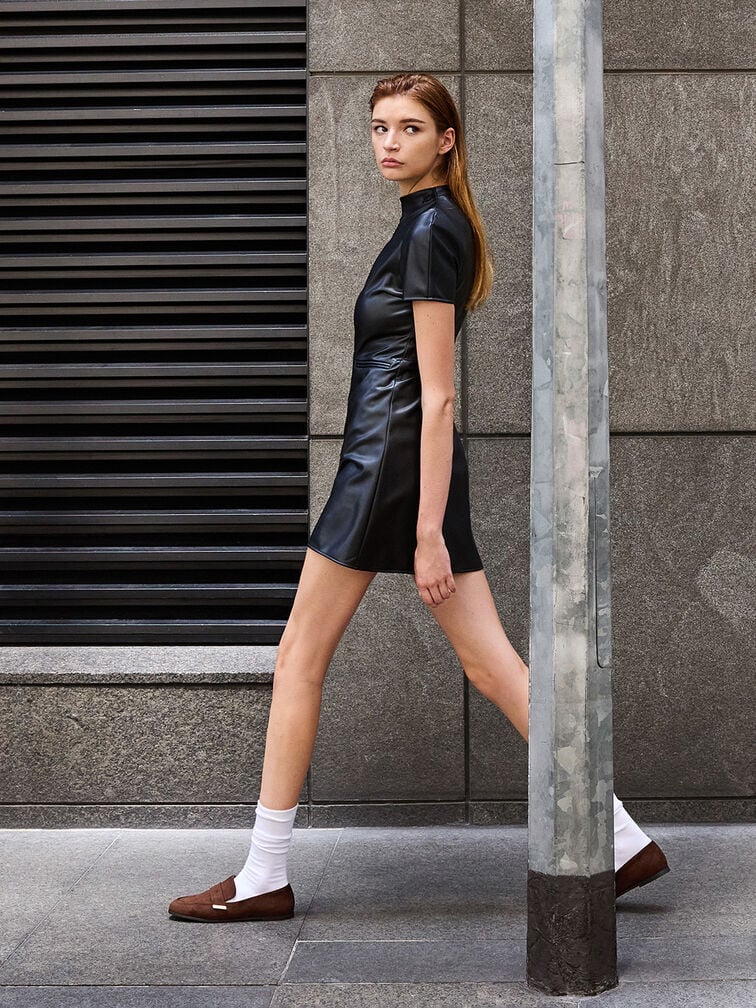 A socks-and-loafers combination styled with a chic mini dress.