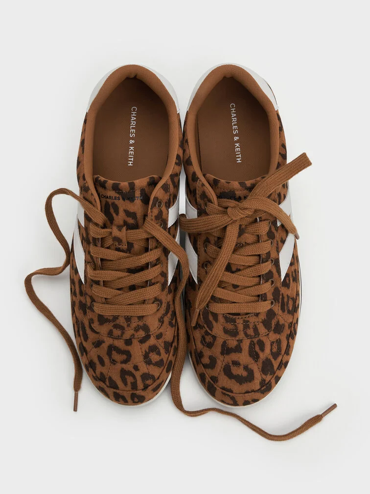 Leopard-print low-top trainers, perfect for making a bold style statement on the pickleball court. 