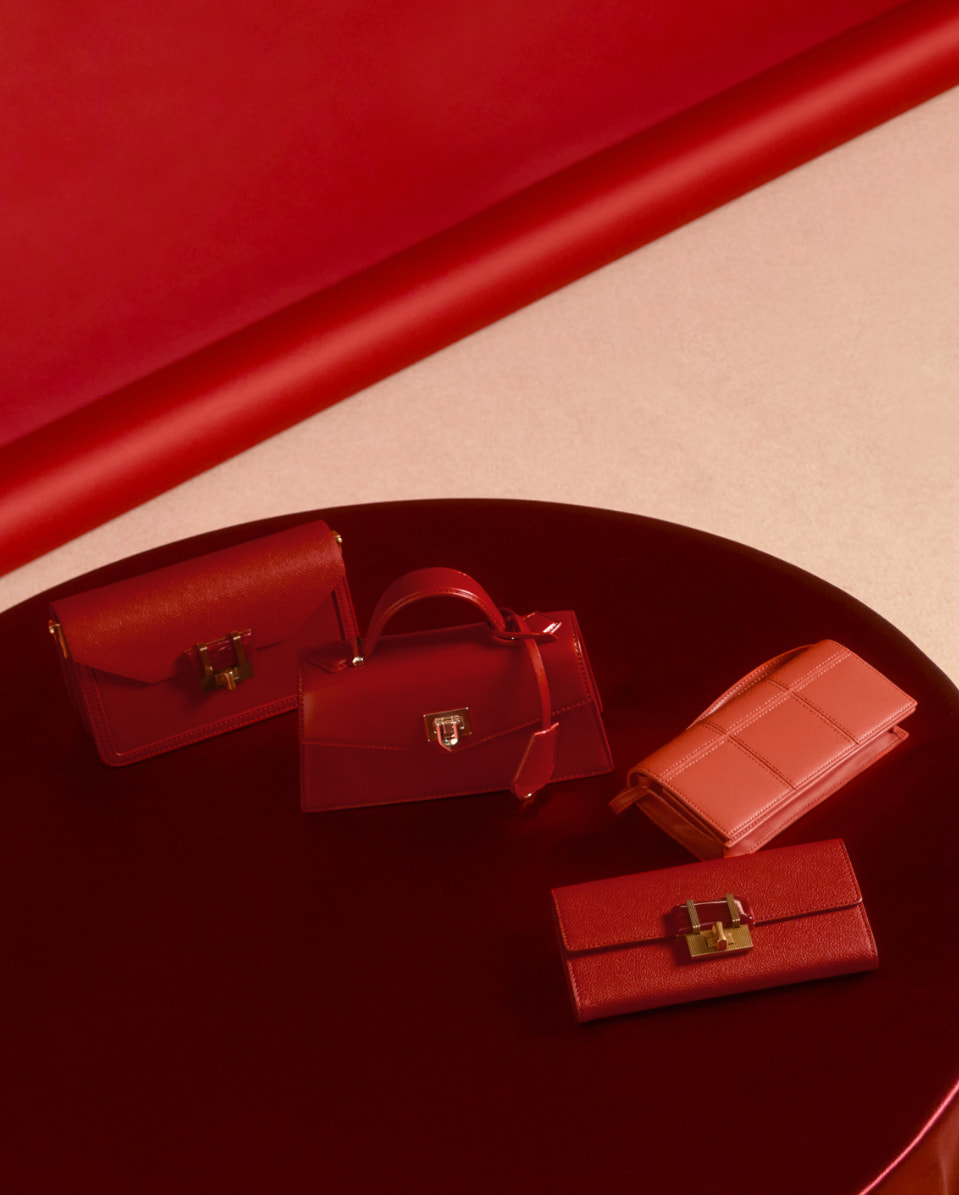 Women’s stone-embellished envelope bag, trapeze top handle bag, stone-embellished long wallet and panelled long wallet – CHARLES & KEITH