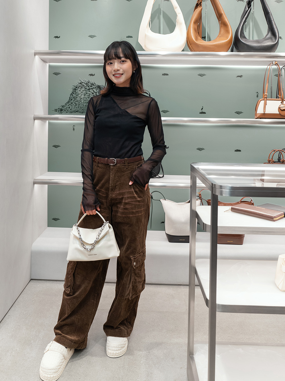 Women’s Andromeda chunky-chain top handle bag and Loren textured flatform mules, as seen on Ah Sin - CHARLES & KEITH