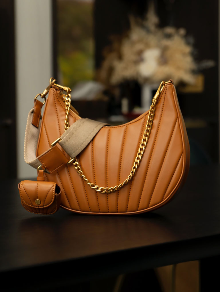 women’s chain handle pleated moon bag in tan - CHARLES & KEITH