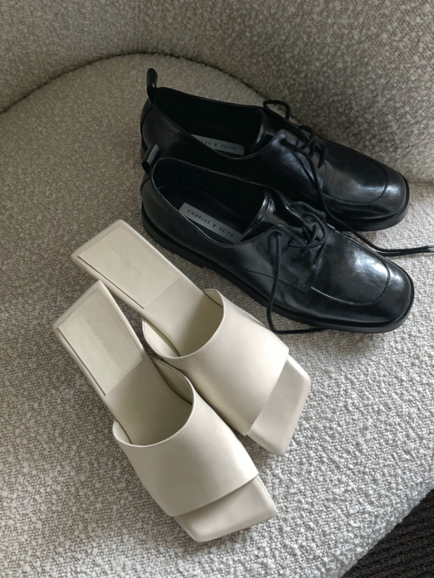 Women’s Zadie padded shoulder bag, asymmetric square toe mules in white and ankle strap derby shoes in black, as seen on Kristen Marie Nichols - CHARLES & KEITH