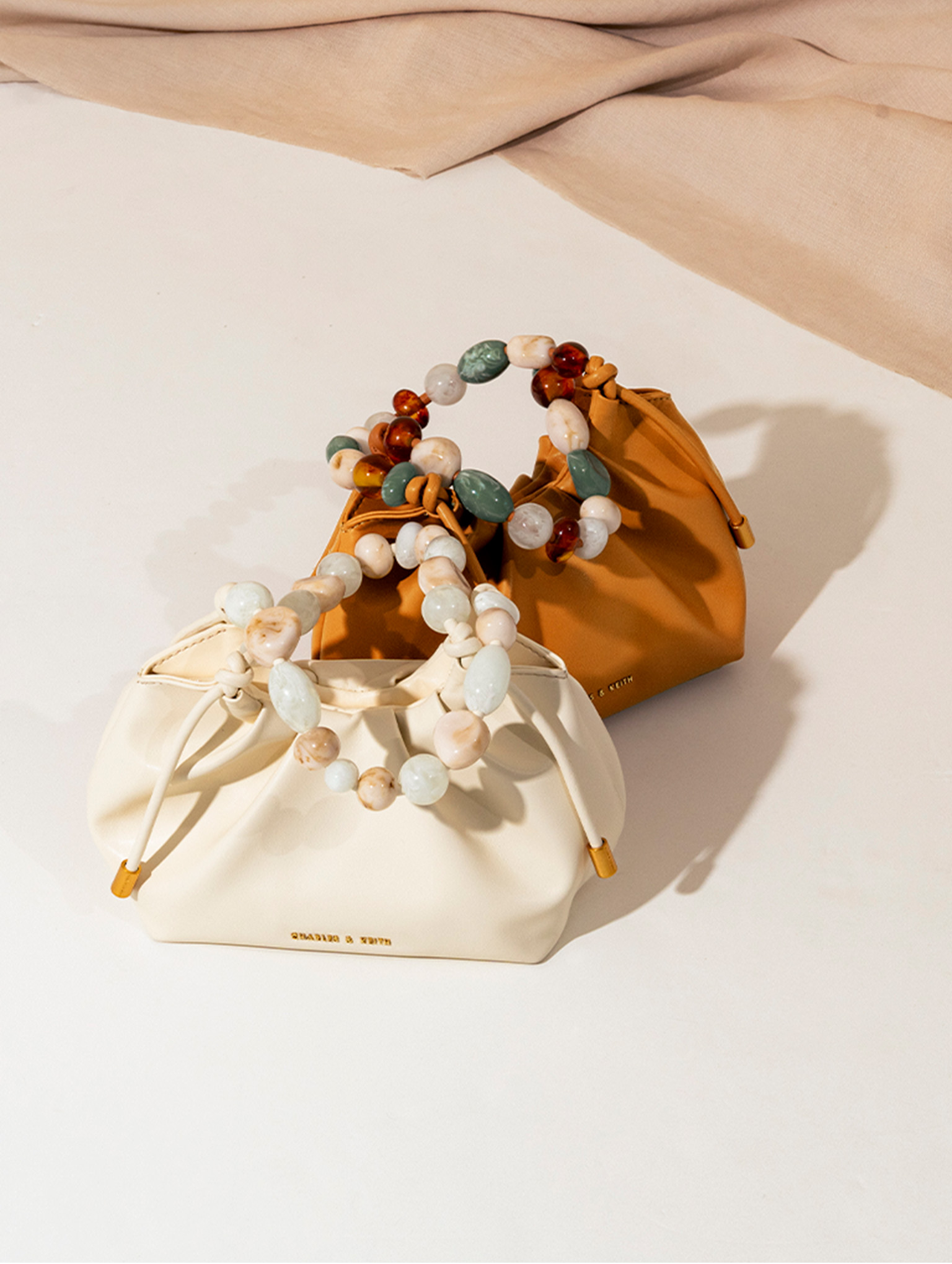 Women’s Aviary Beaded Acrylic Handle Slouchy Bag in pumpkin and cream - CHARLES & KEITH