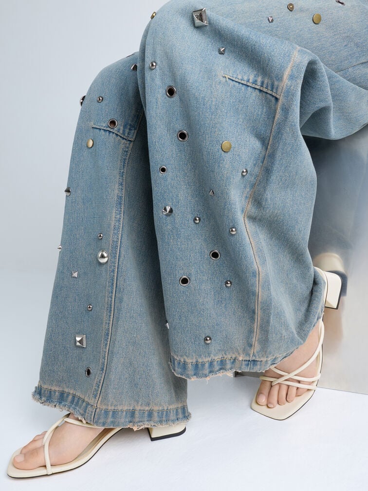 White shoes complement light-wash denim. 