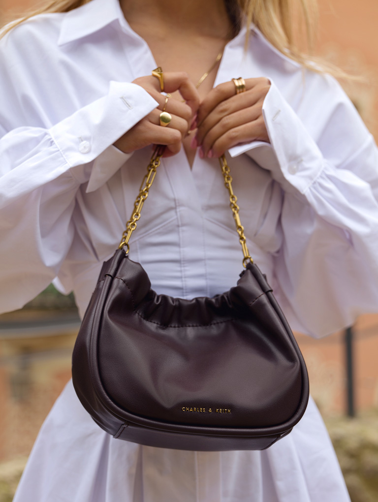 Women’s Solange double chain handle slouchy bag and textured thigh-high block heel boots, as seen on Lily May Mac - CHARLES & KEITH