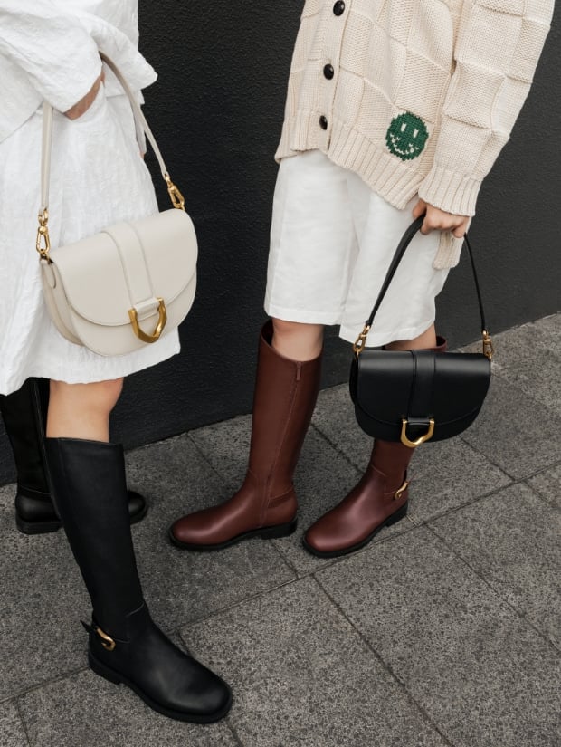 Gabine buckled leather knee-high boots in black, Gabine saddle bag in chalk, Gabine saddle bag in brown and Gabine buckled leather knee-high boots in brown - CHARLES & KEITH