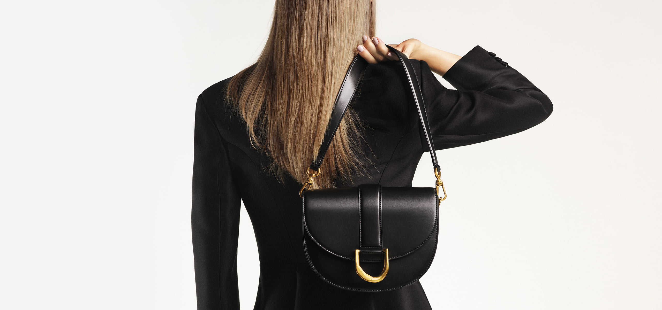 Women’s metallic buckle saddle bag in black (close up) – CHARLES & KEITH