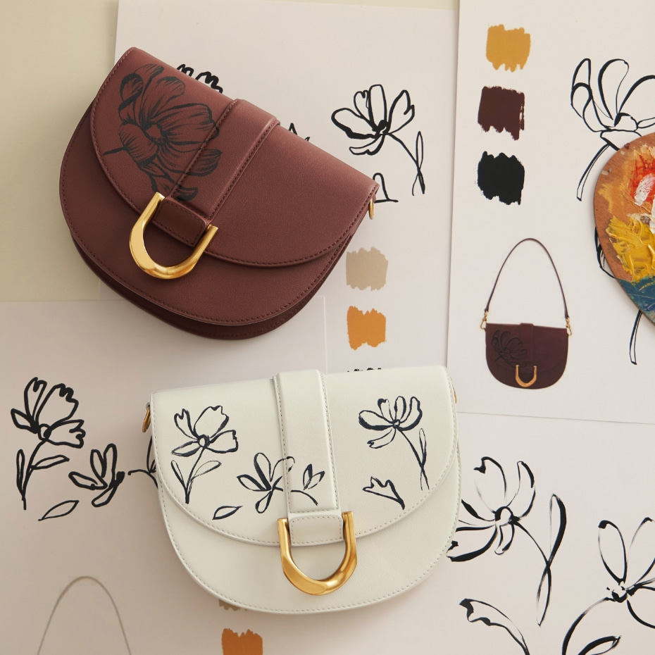 Hand-painted floral Gabine leather saddle bags in brown and chalk - CHARLES & KEITH