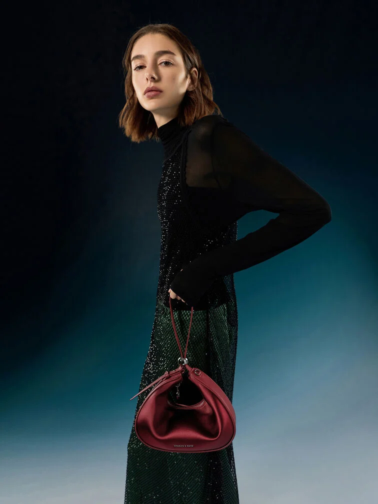 A classic bag that has an eye-catching finish or a bold hue makes for a perfect party bag.