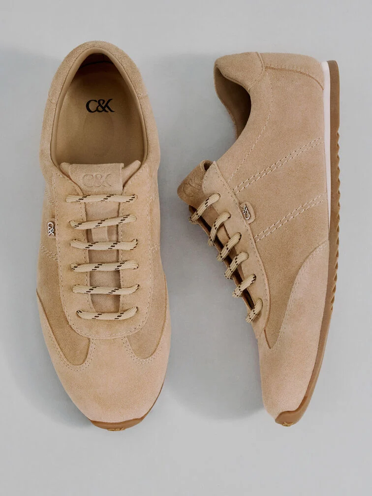  Low-profile trainers that are made with earth-tone suede have a luxurious appearance that will look right at home at a business-casual event. 