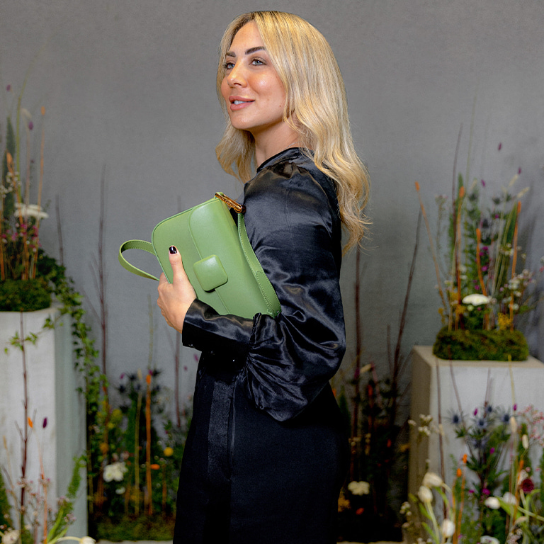 Women’s Koa square push-lock shoulder bag in green, as seen on Shirine Zaatari - CHARLES & KEITH