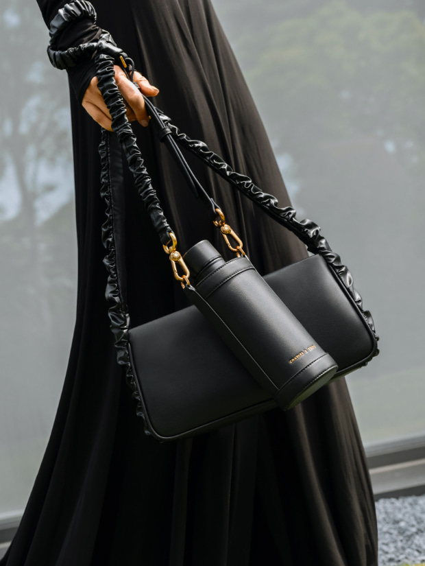 Women’s Riley ruffle-trim bag in black and Riley ruched strap bottle holder in black - CHARLES & KEITH