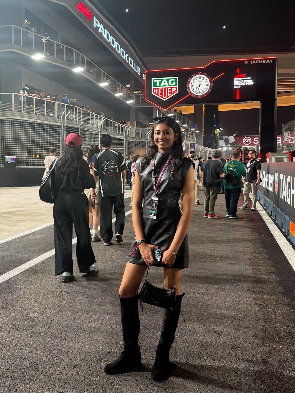 Women’s Elspeth croc-effect chain-link shoulder bag and Louisa faux suede fold-over thigh-high boots, as seen on Kareen Kaur at Singapore F1 2026 - CHARLES & KEITH