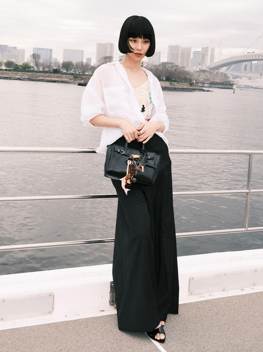 Women’s Delfina belted tote bag and Delfina dolphin & starfish charm, as seen on Ruka Xing - CHARLES & KEITH