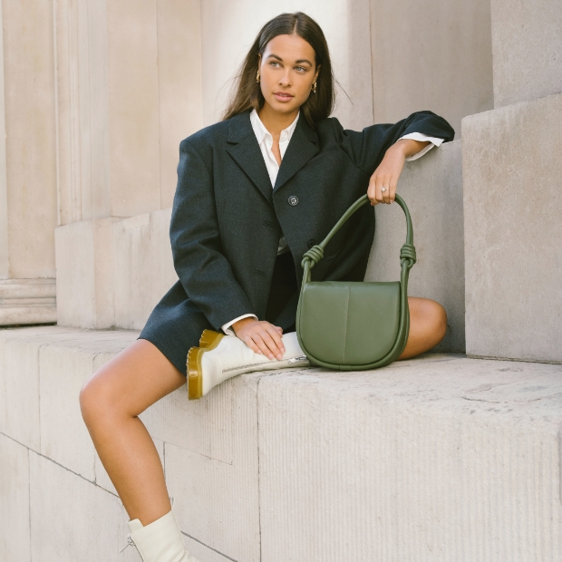 Women’s Luna knotted handle shoulder bag and Nola slip-on ankle boots, as seen on Anna and Sonia Kuprienko – CHARLES & KEITH