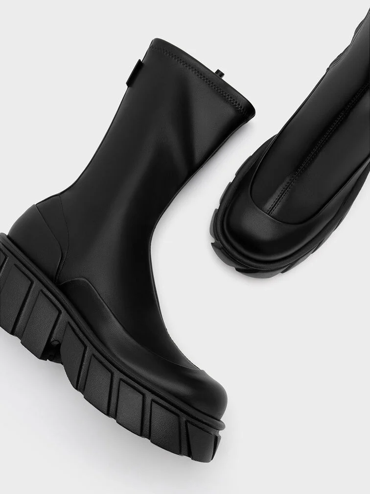 Platform ankle boots featuring chunky soles.