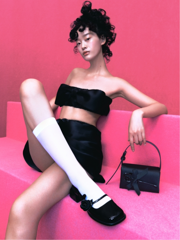 Women’s Chloris patent leather rose-embellished Mary Jane pumps and Chloris satin & leather rose motif shoulder bag in black from the SHUSHU/TONG x CHARLES & KEITH collection, modelled by Ruiqi Jiang – CHARLES & KEITH