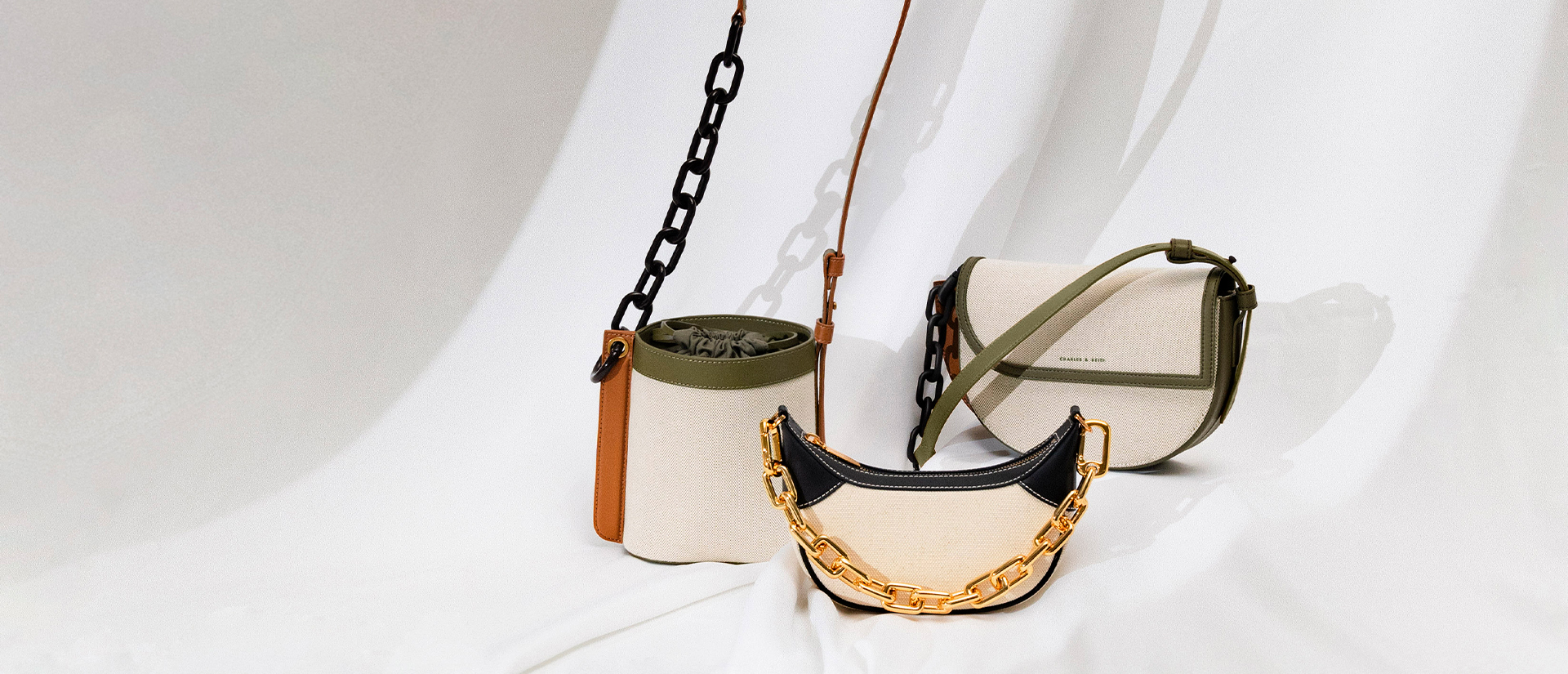 Women's multicoloured Alden canvas half-moon bag, Alden chain-link canvas drawstring bucket bag, Shalia canvas chain-handle moon bag - CHARLES & KEITH