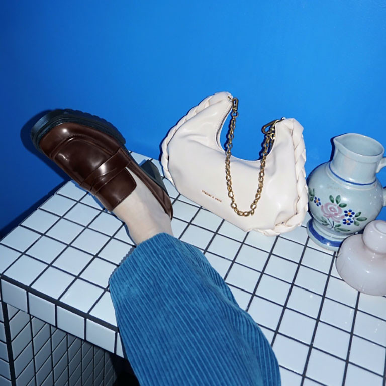 Women’s chain handle braided hobo bag in cream and penny loafer pumps, as seen on Anne Johannsen - CHARLES & KEITH