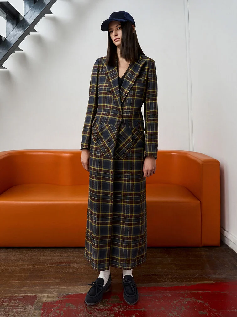 Loafers put the finishing touch to a preppy long plaid dress.