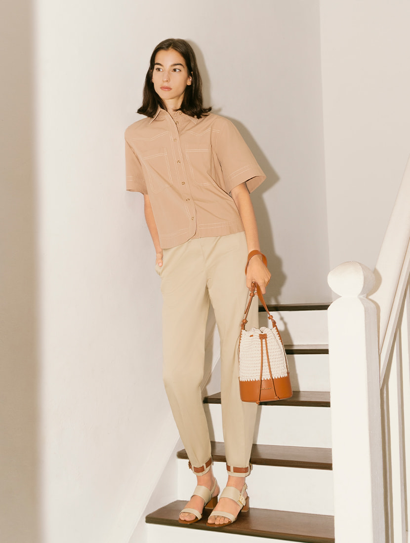 Women’s crochet drawstring bucket bag in cognac and raffia buckle strap sandals - CHARLES & KEITH