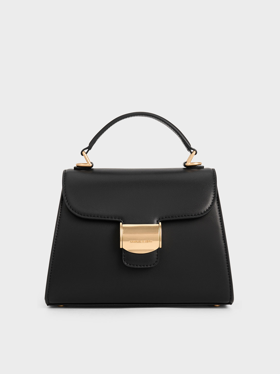 Shop Charles & Keith Violetta Trapeze Top Handle Bag In Black