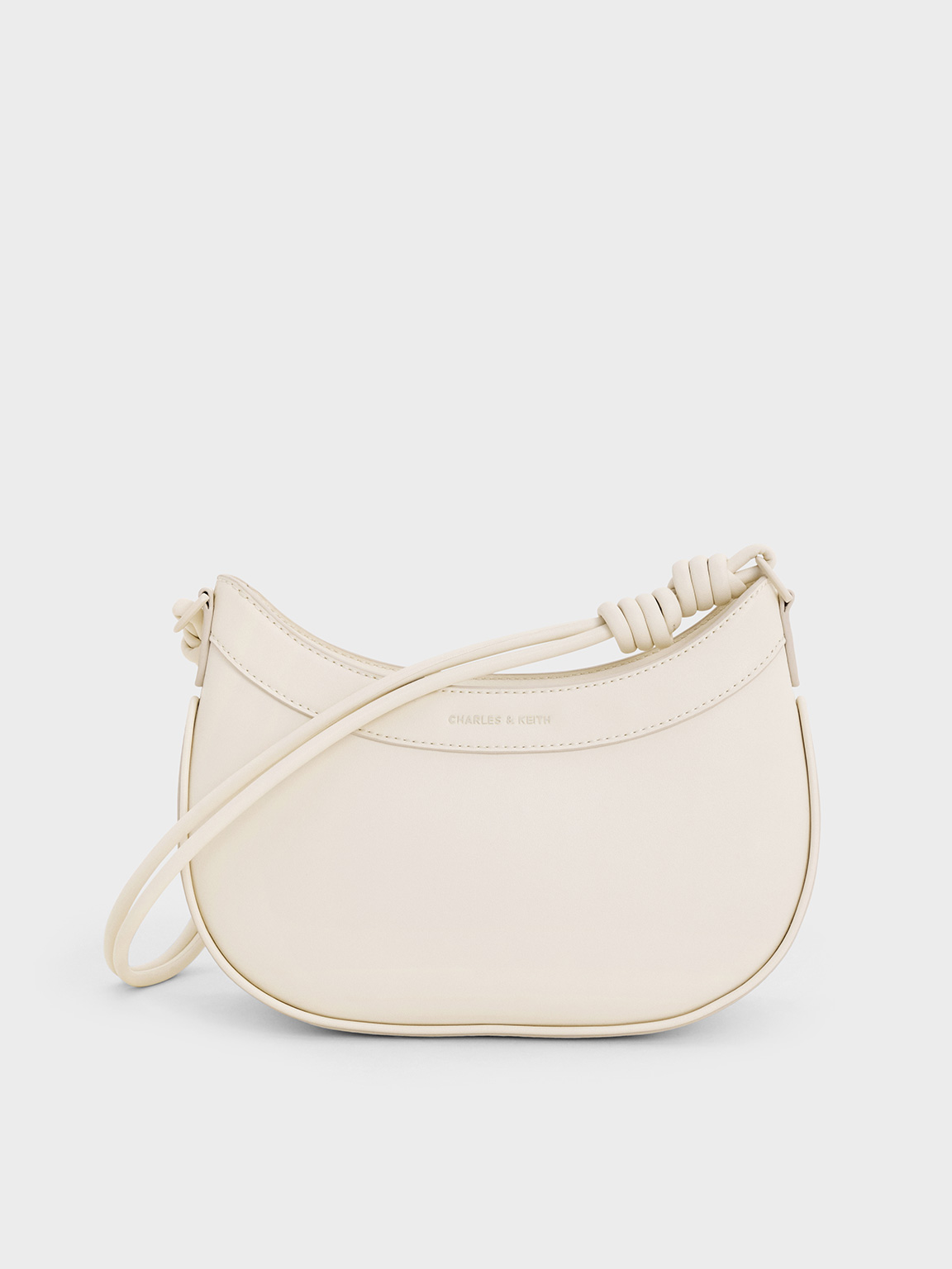Charles & Keith - Sabine Knotted-strap Curved Shoulder Bag In Cream