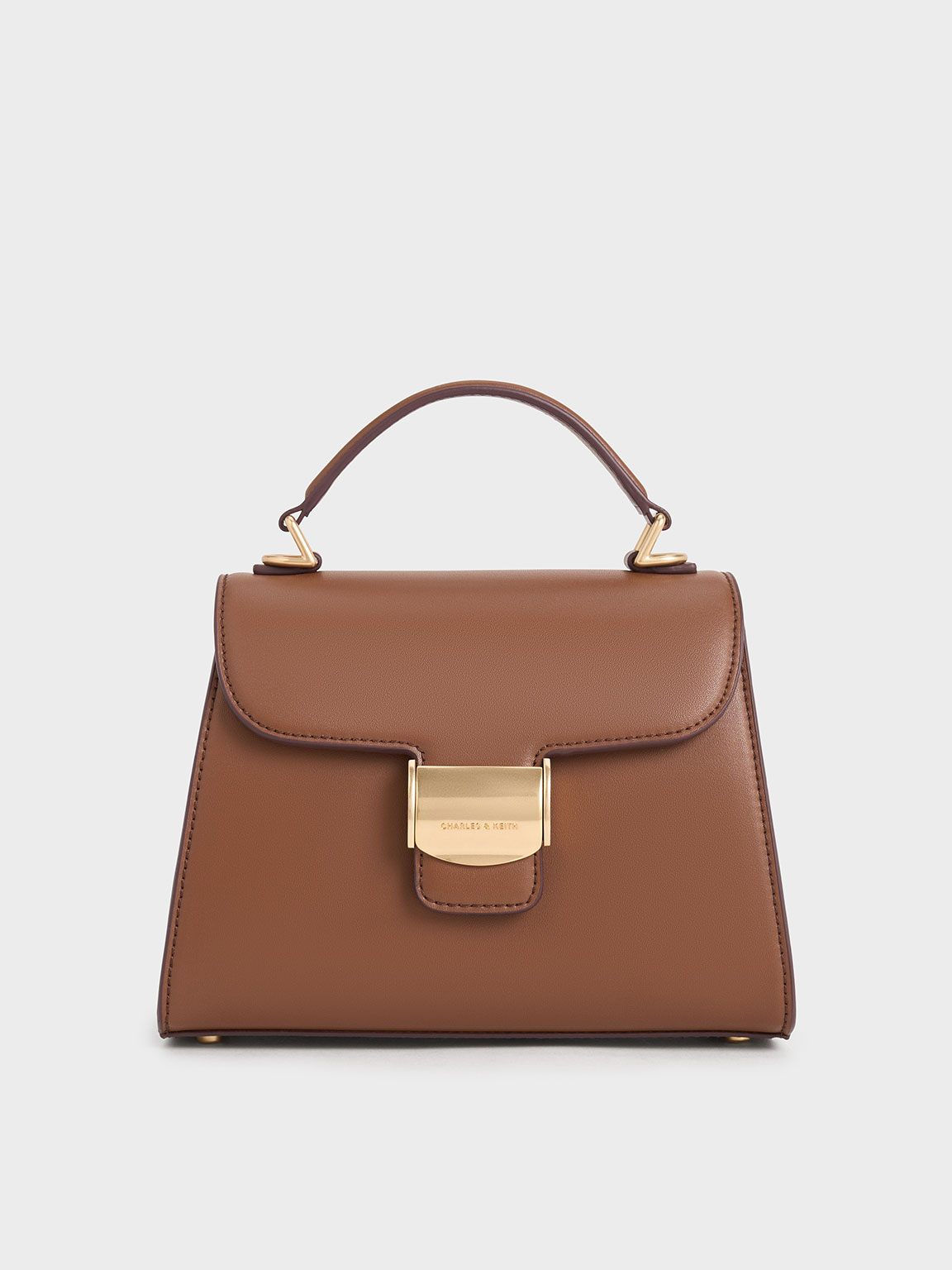 Shop Charles & Keith Violetta Trapeze Top Handle Bag In Chocolate