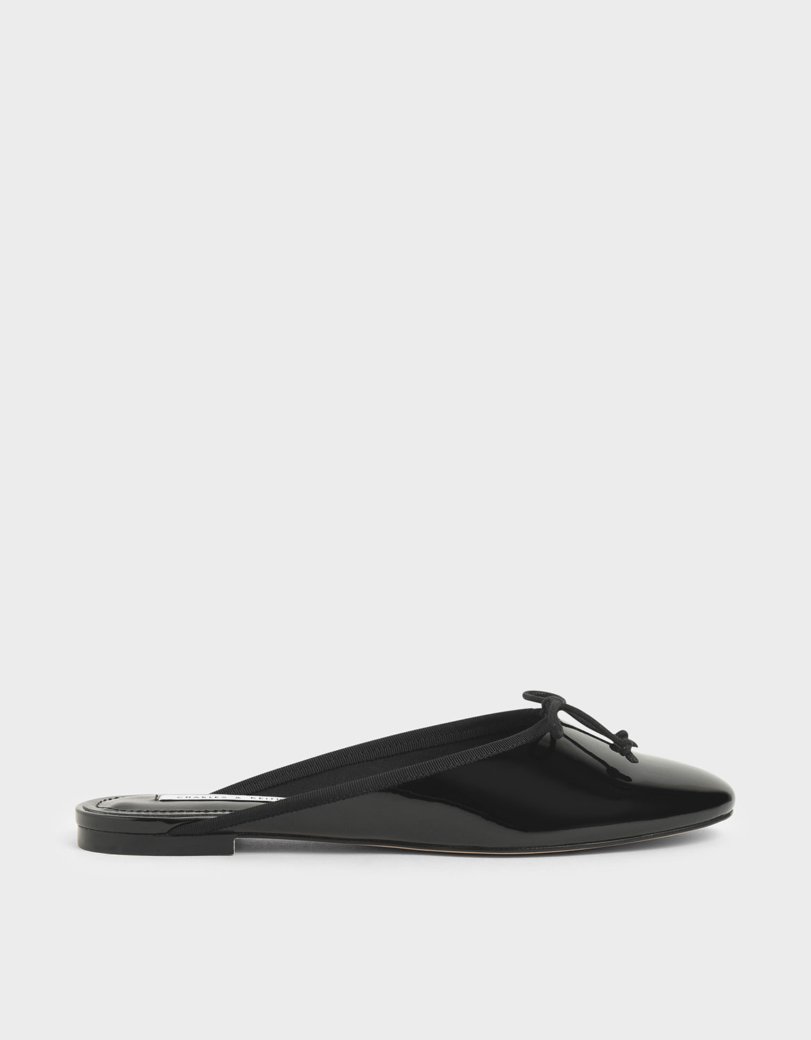 

Patent Bow Flat Mules, Black